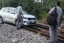 telengna-car-on-railway-track